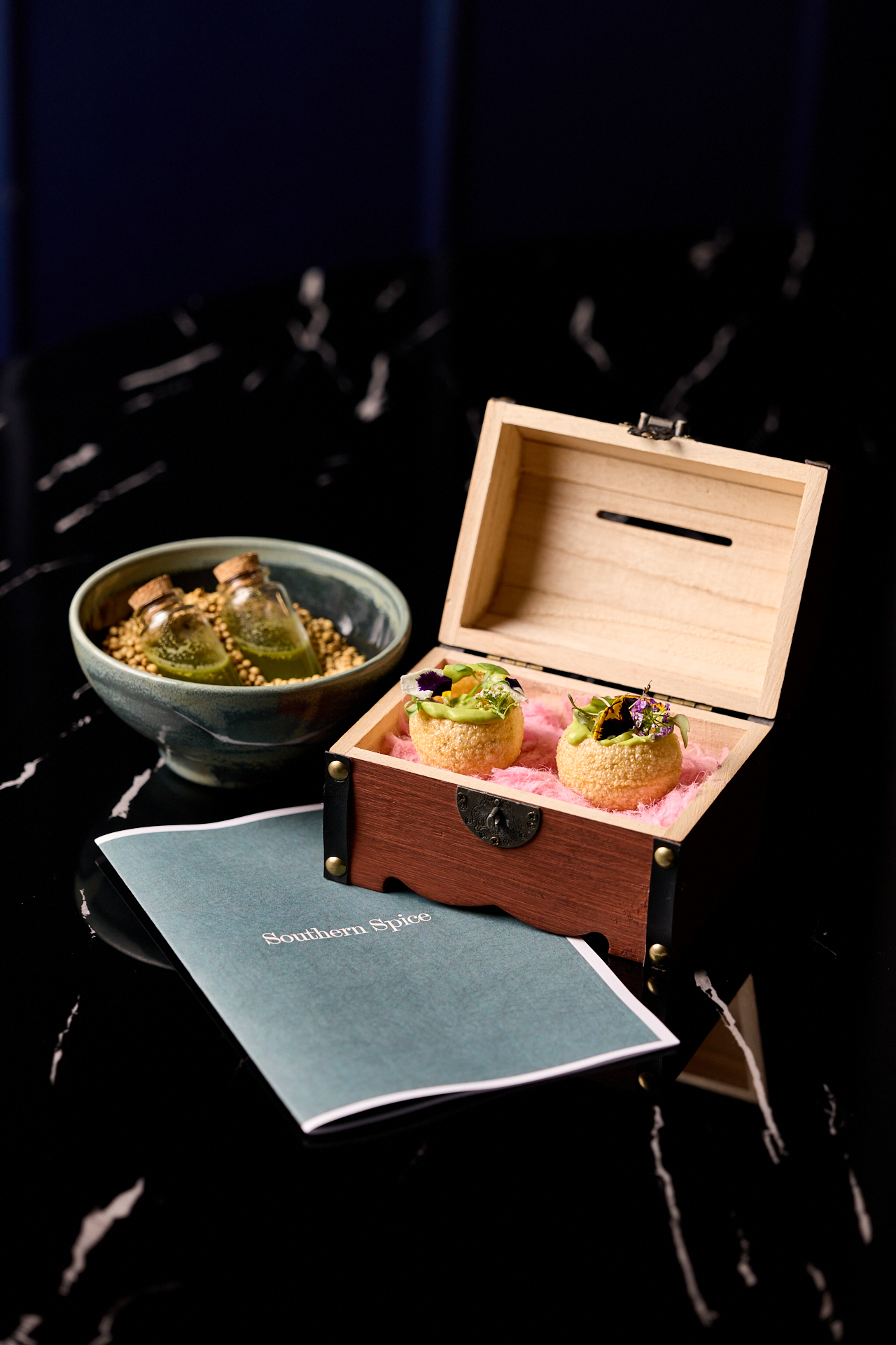 Chettinad Chicken Curry slow-cooked in a deep spiced gravy with red chillies and coriander in a karahi